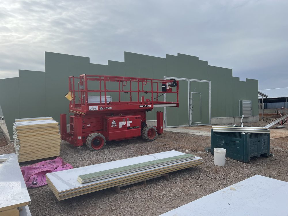 Custom commercial shed build, wall panels going up