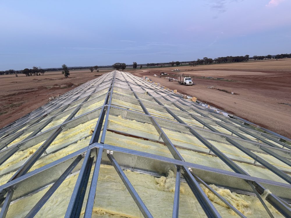Roof insulation and framing at dusk